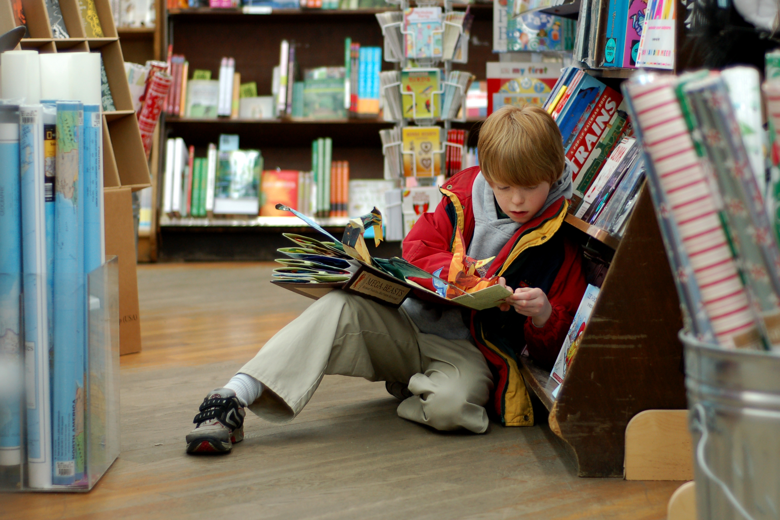 Child_reading_at_Brookline_Booksmith